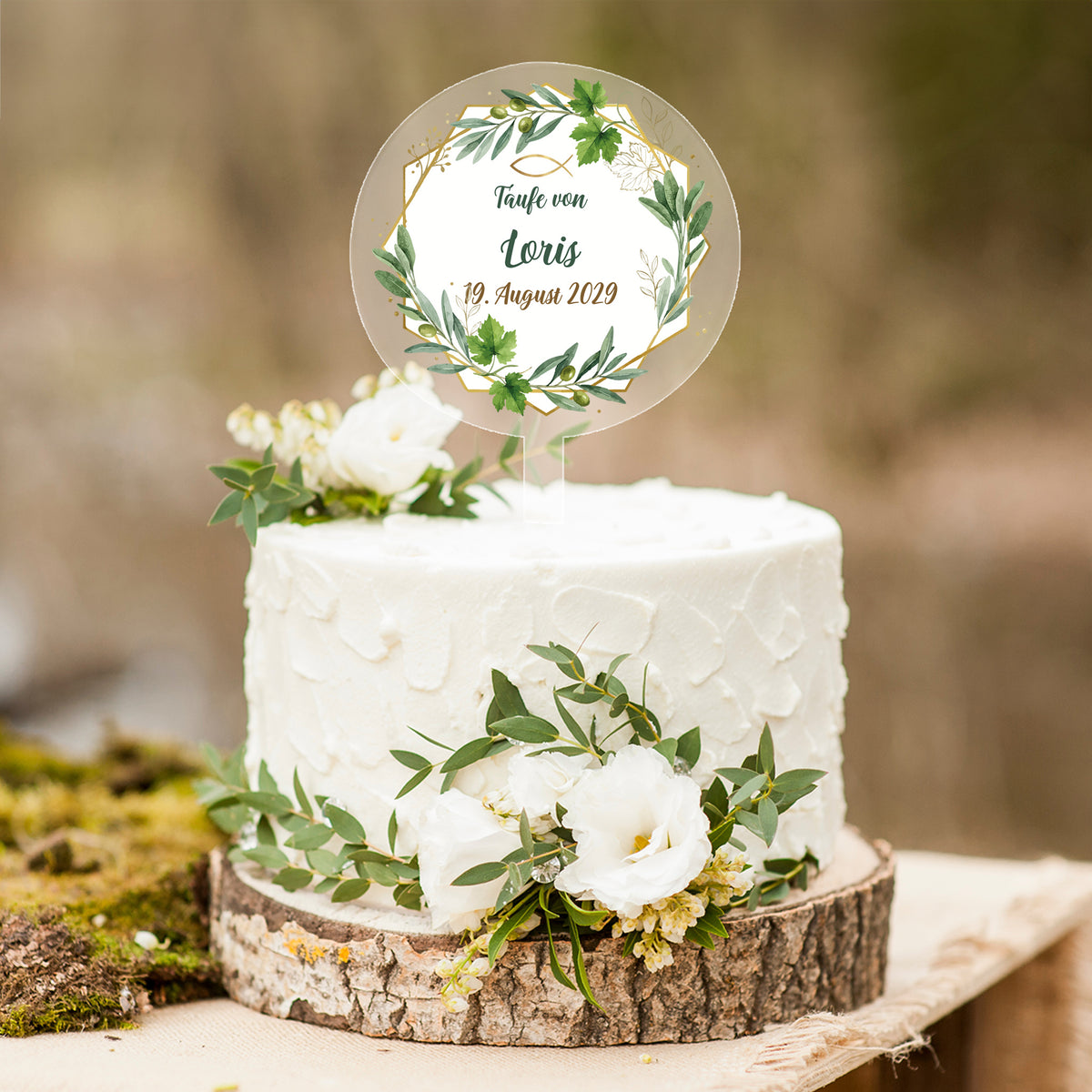 Personalisierter Tortentopper zur Taufe mit Eukalyptus-Motiv und Name Loris auf weißer Torte
