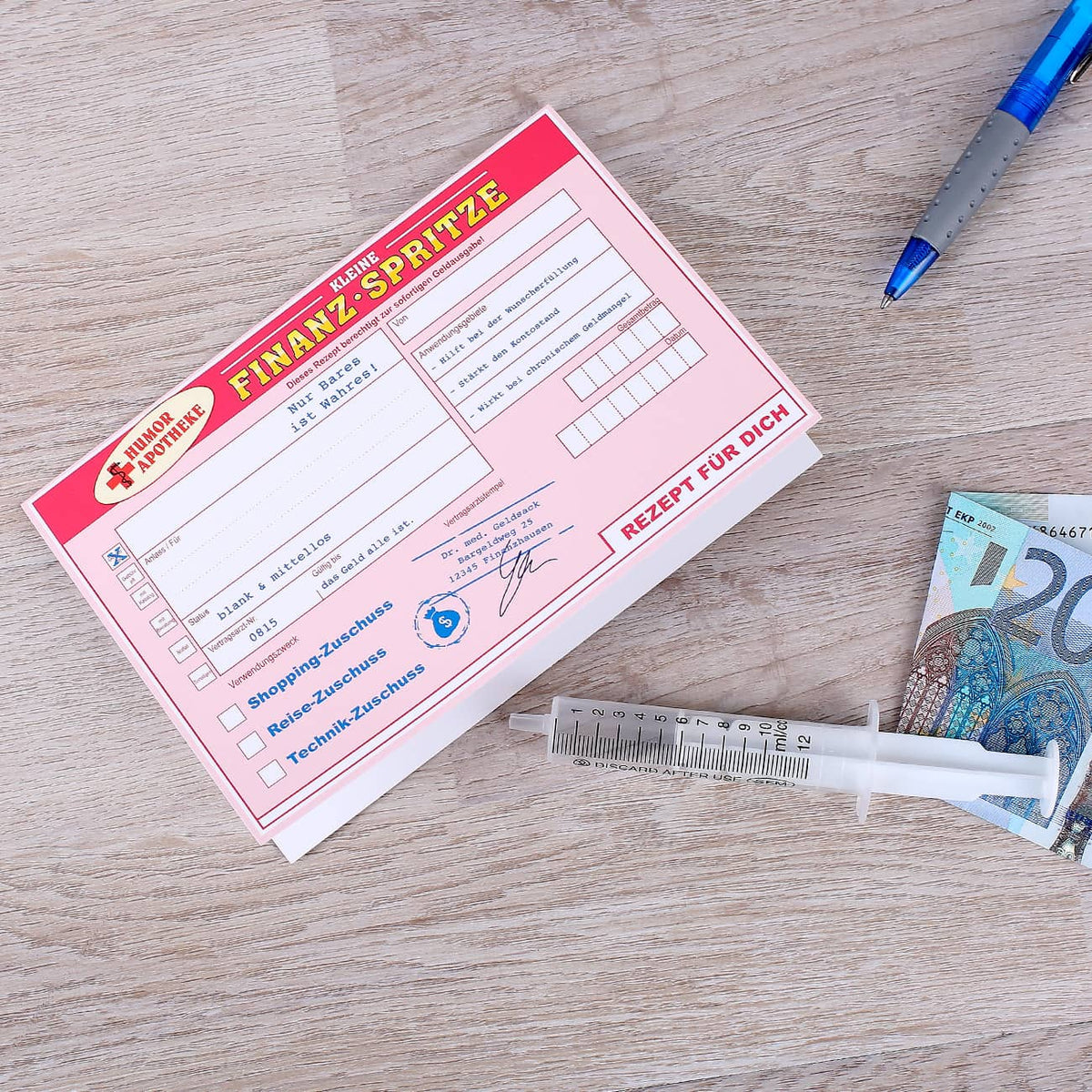 Finanzspritze mit Glückwunschkarte