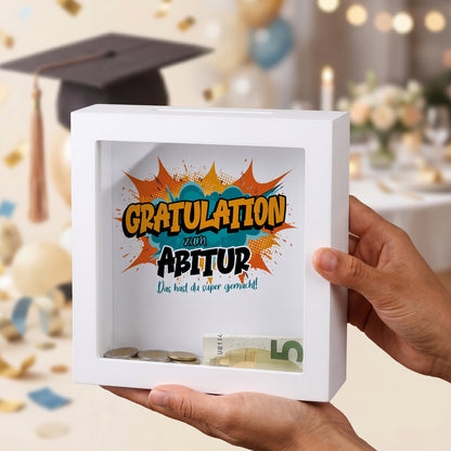 Weiße Bilderrahmen-Spardose als Geldgeschenk zum Abitur mit Comic-Motiv „Gratulation“