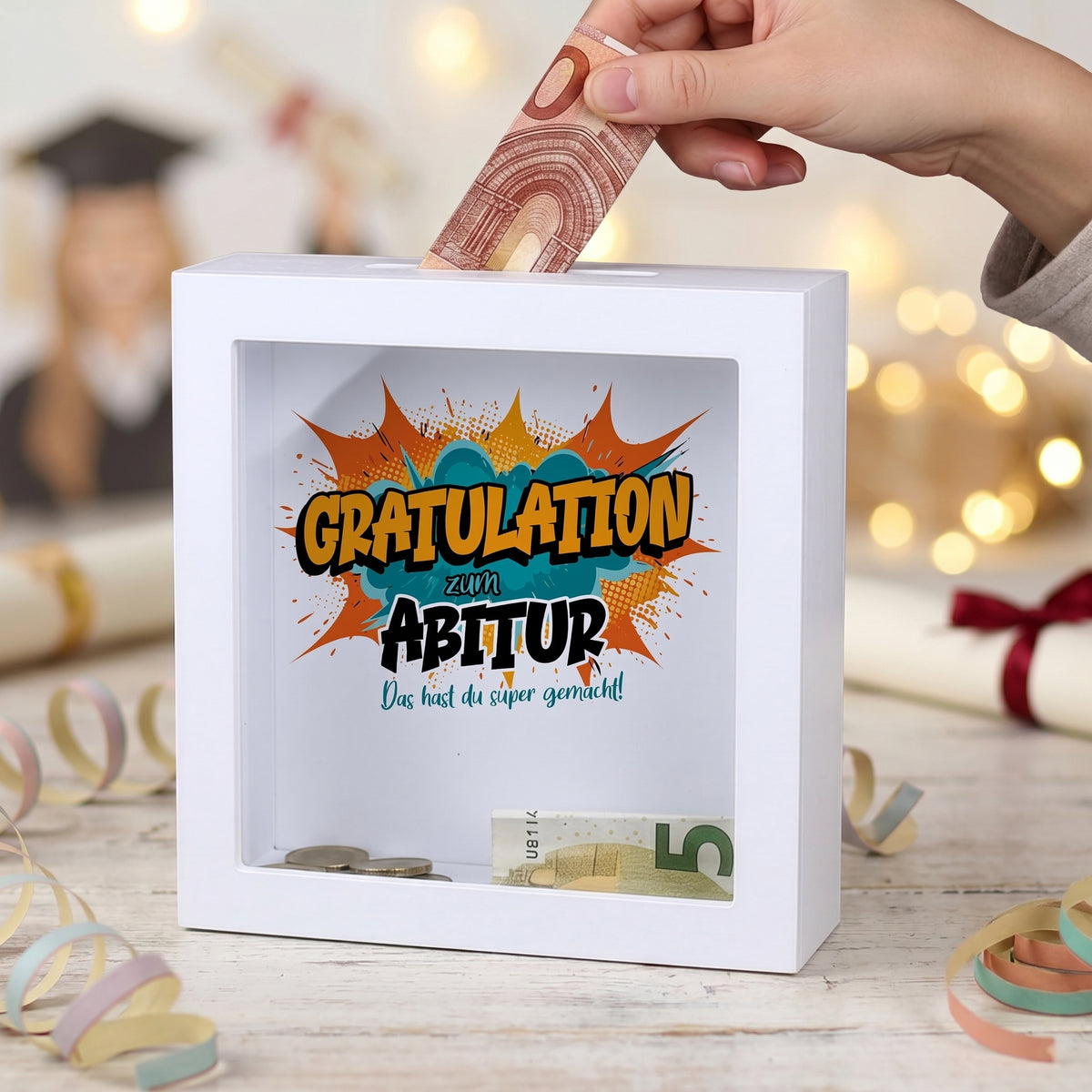 Weiße Bilderrahmen-Spardose als Geldgeschenk zum Abitur mit Comic-Motiv „Gratulation“