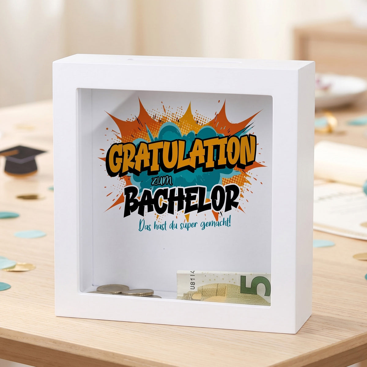Bilderrahmen-Spardose „Gratulation zum Bachelor“ mit Geldschein und Münzen hinter Glas