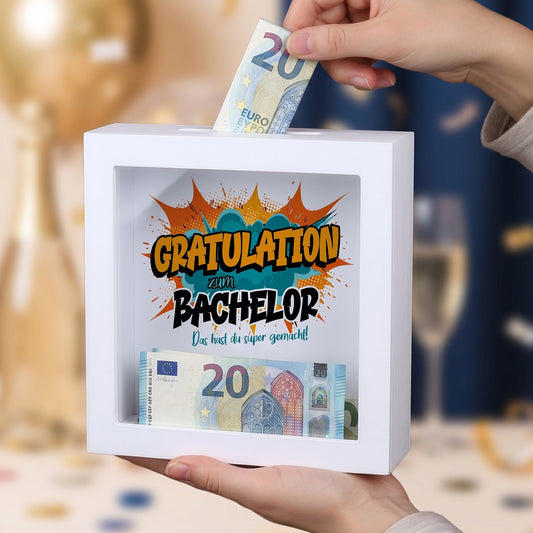 Bilderrahmen-Spardose „Gratulation zum Bachelor“ mit Geldschein und Münzen hinter Glas