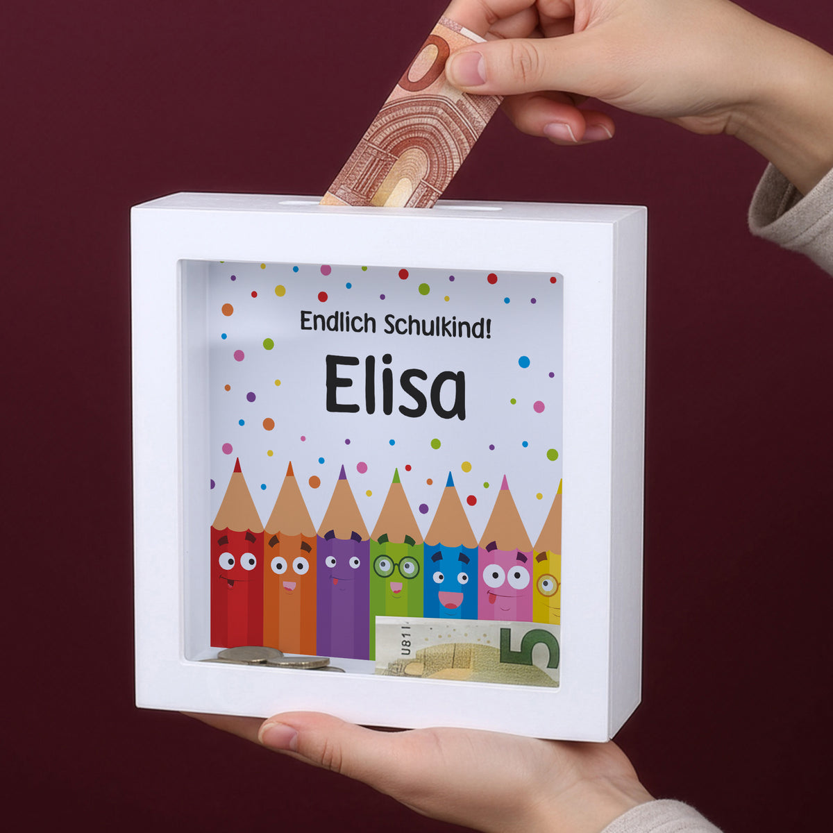 Personalisierte Bilderrahmen-Spardose mit Name Elisa und Geldschein im Geldschlitz