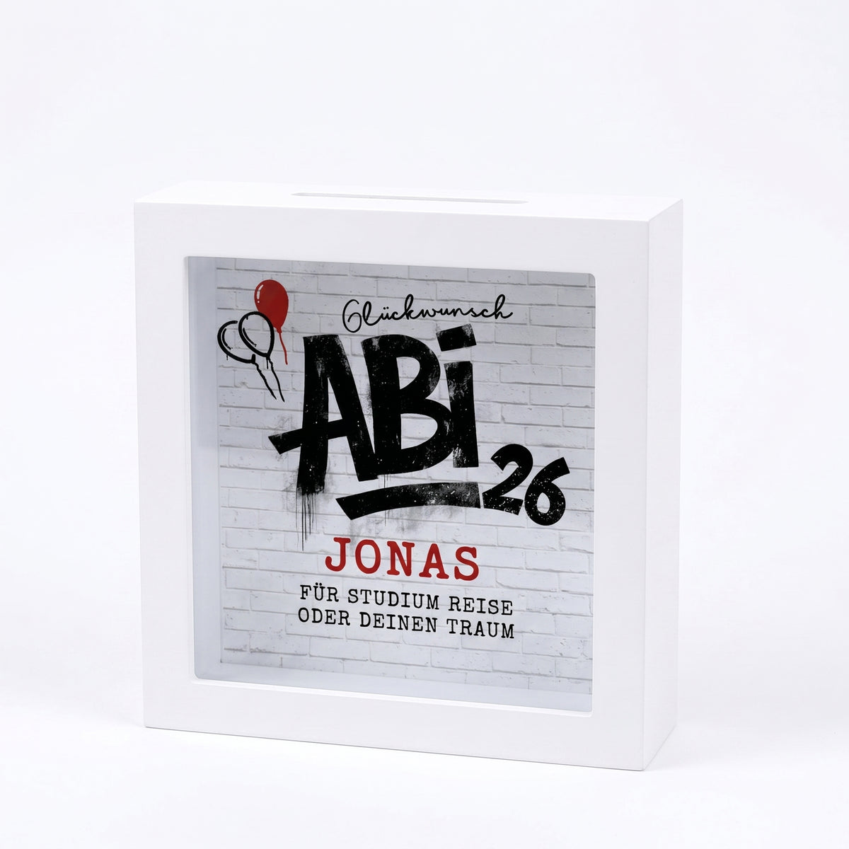 Weiße Spardose mit Abi 26 Motiv und Name Jonas freigestellt vor hellem Hintergrund