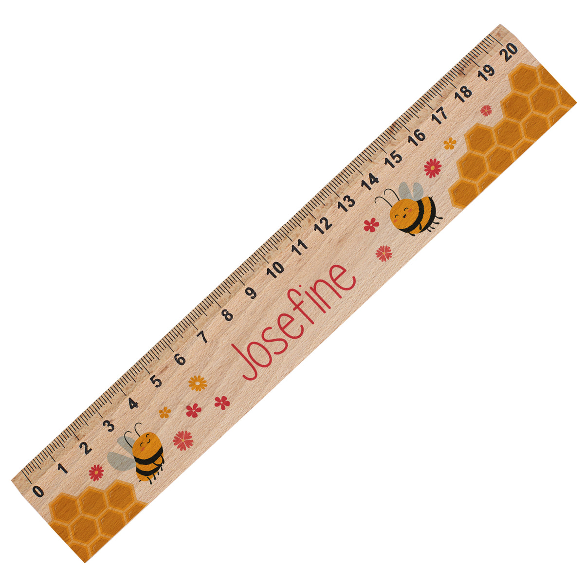 Freigestelltes Holzlineal mit Bienen, Honigwaben und Name Josefine auf weißem Hintergrund