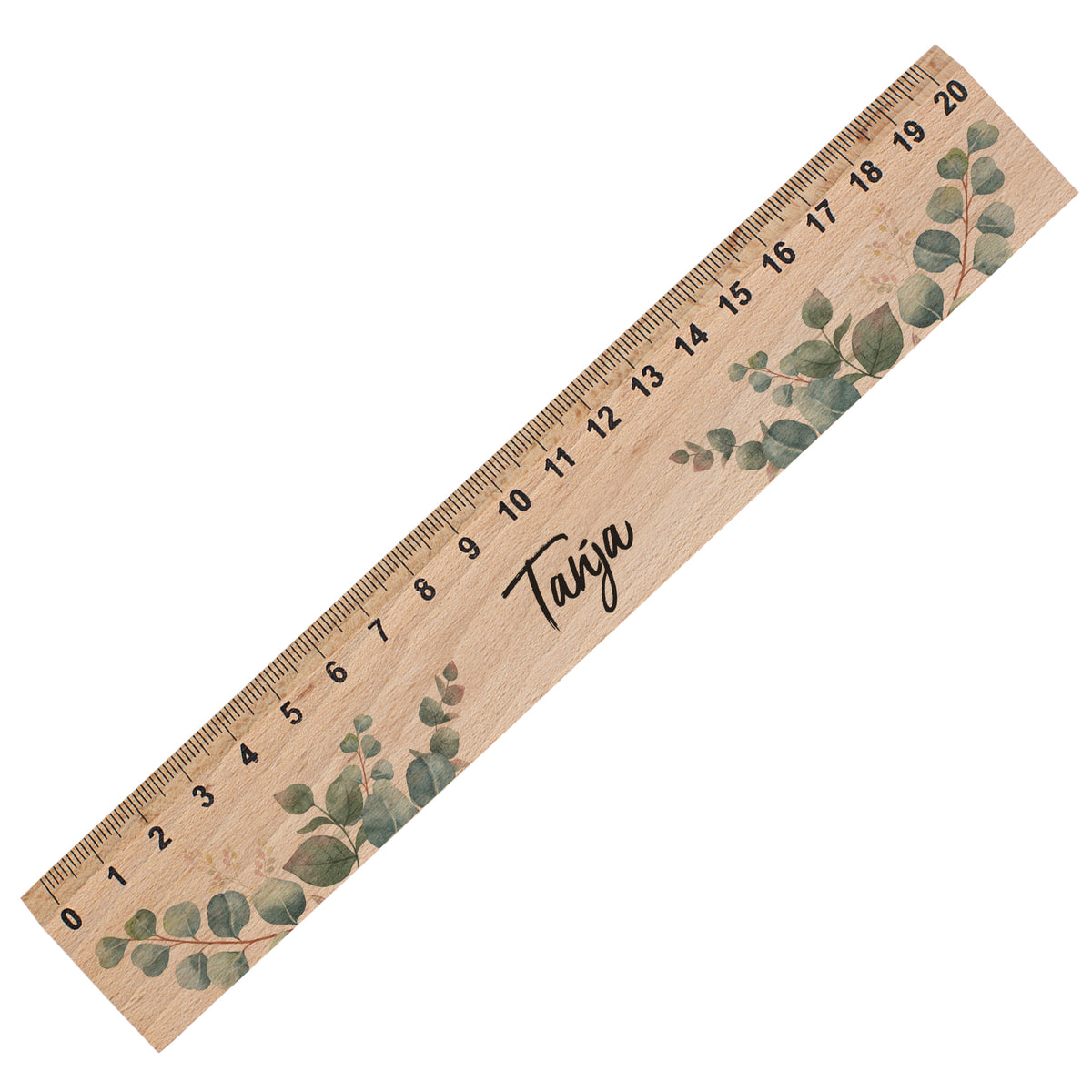 Freigestelltes personalisiertes Holzlineal mit Name Tanja und Eukalyptusdesign auf weißem Hintergrund
