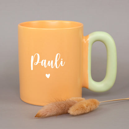 Orange Tasse mit Name Lisa und Herz sowie hellgrünem Griff