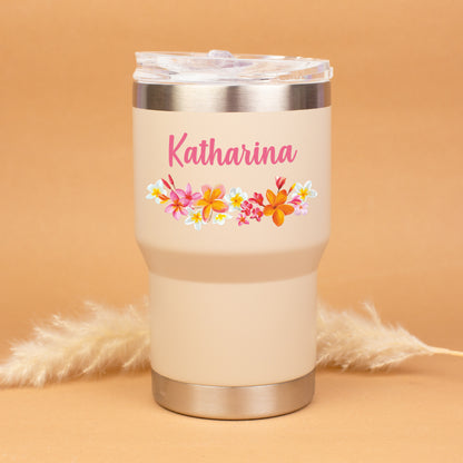 Beigefarbener Thermobecher mit buntem Blumenmotiv und Name Katharina personalisiert vor warmem Hintergrund