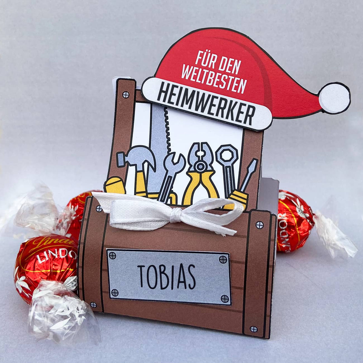 Werkzeugkoffer mit Name und Lindor Füllung