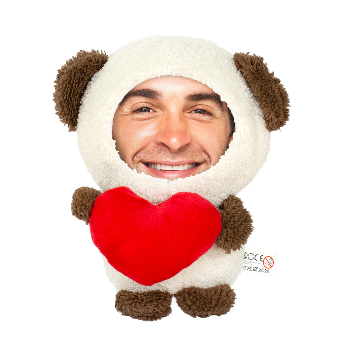 Freigestellter Fototeddy mit lächelndem Gesicht und rotem Herz auf weißem Hintergrund