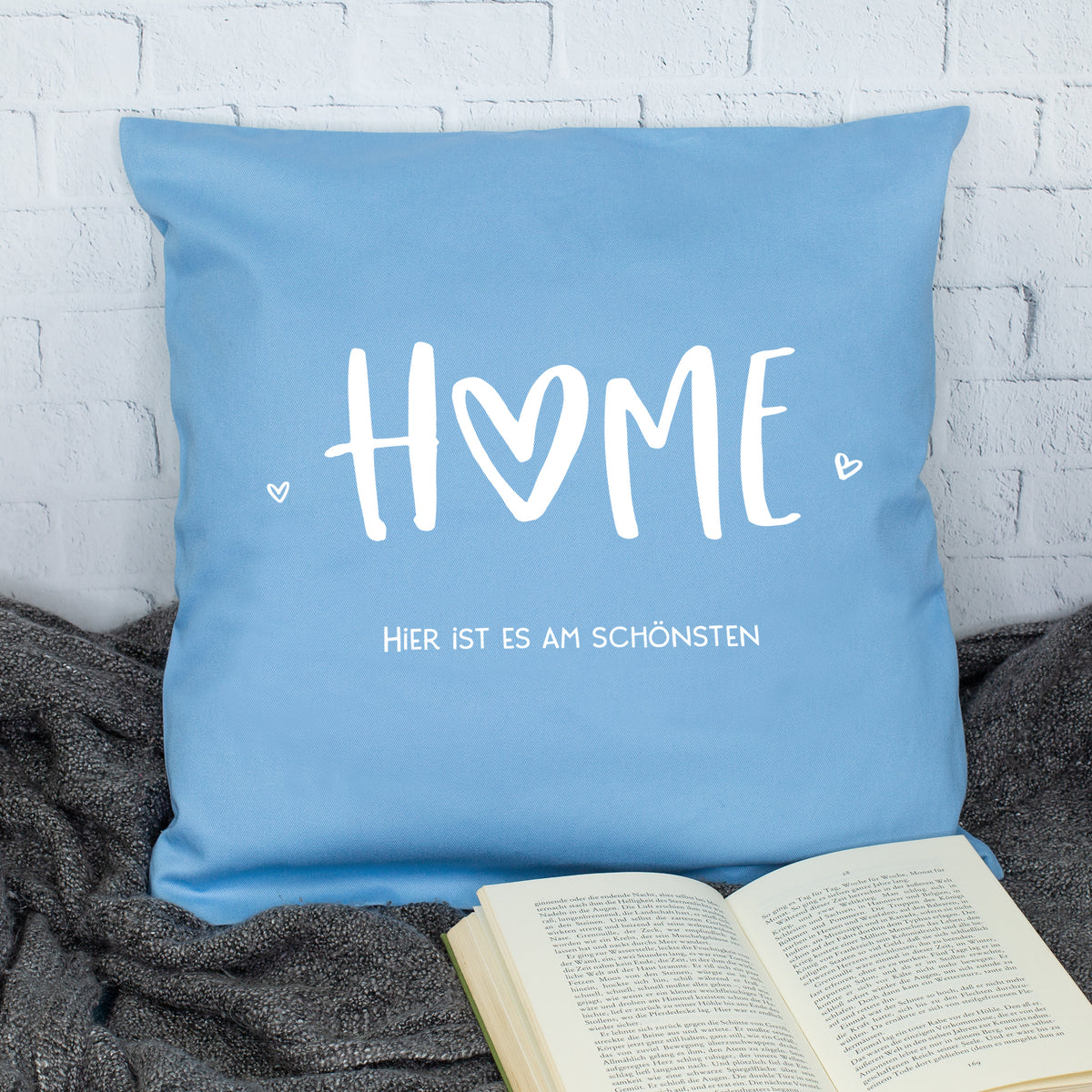 Blaues HOME Kissen mit Spruch Hier ist es am schönsten als Deko für Zuhause