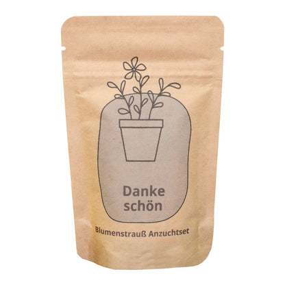Freigestelltes Danke schön Anzuchtset in brauner Kraftpapiertüte mit Blumenmotiv